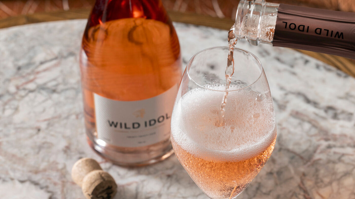 Wild Idol Sparkling Rosé poured into a glass